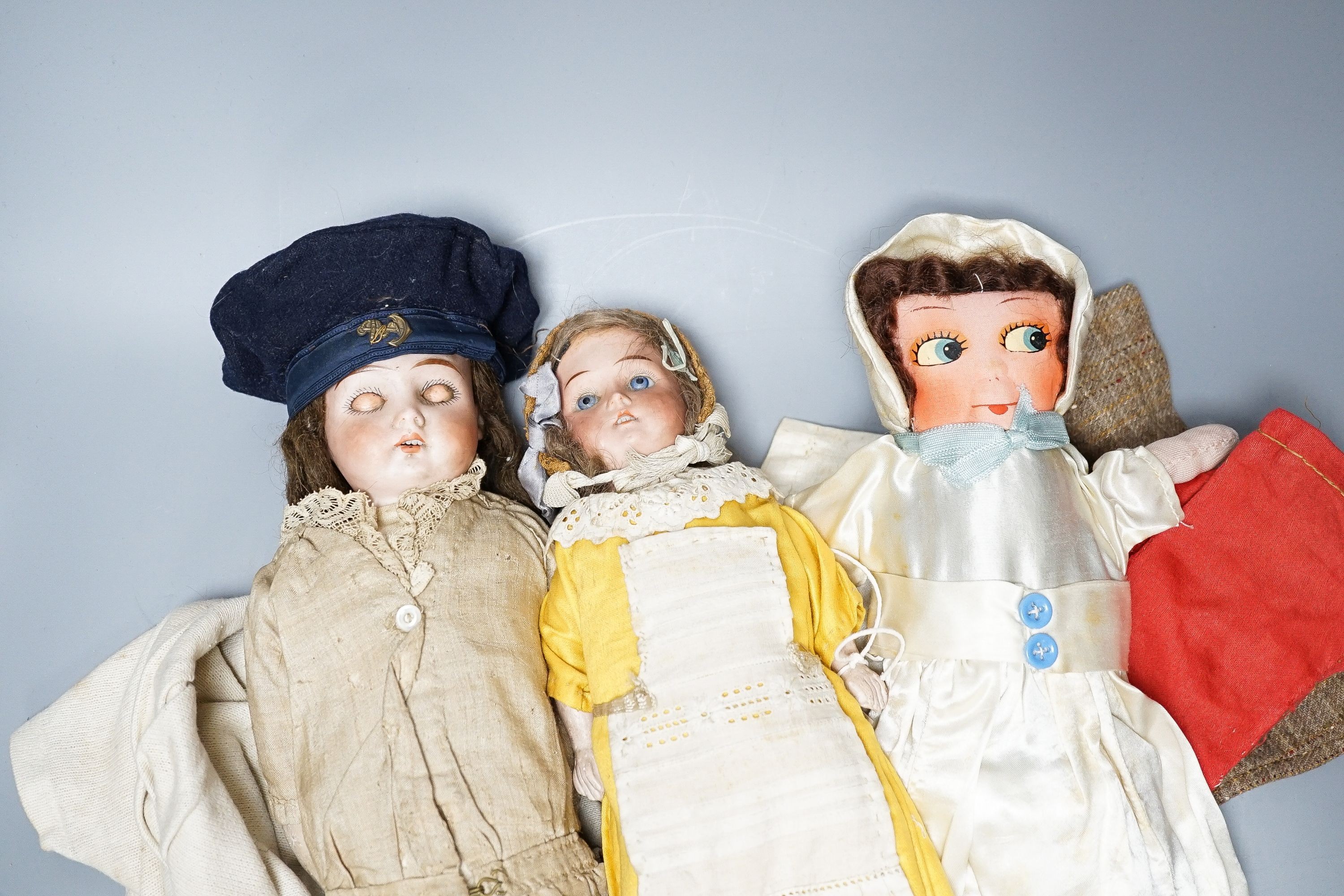 Two German bisque headed dolls, marked ‘Mabel 14/0’, 32cm and the other ‘Darling 6/0’, 42cm and two fabric dolls (4)